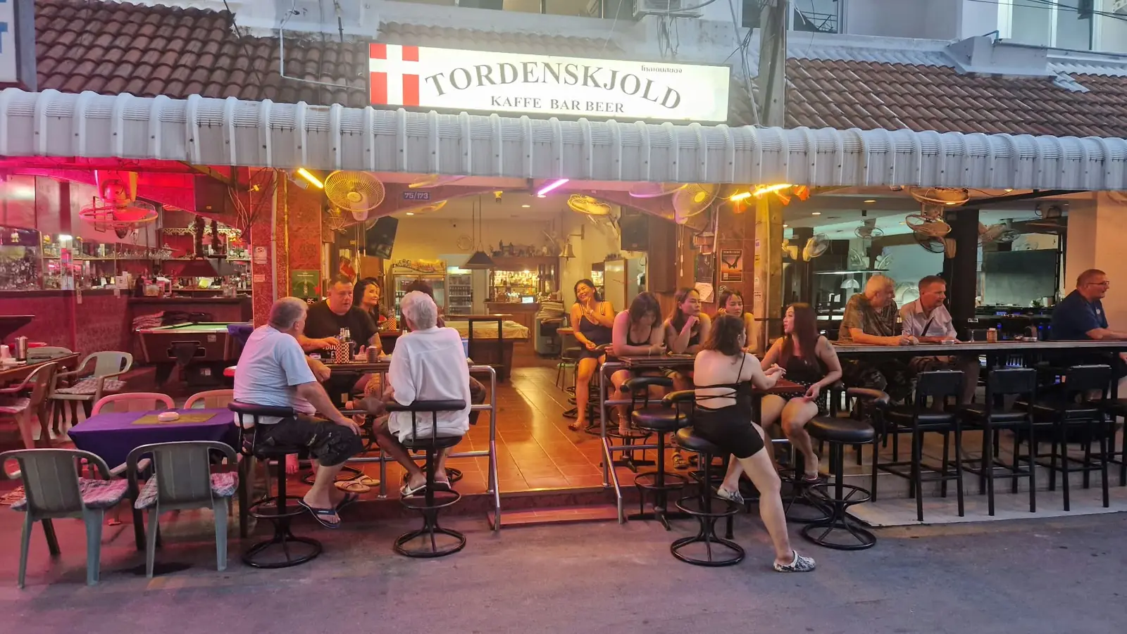 The Tordenskjold sign, red and white Danish flag, above the open bar front